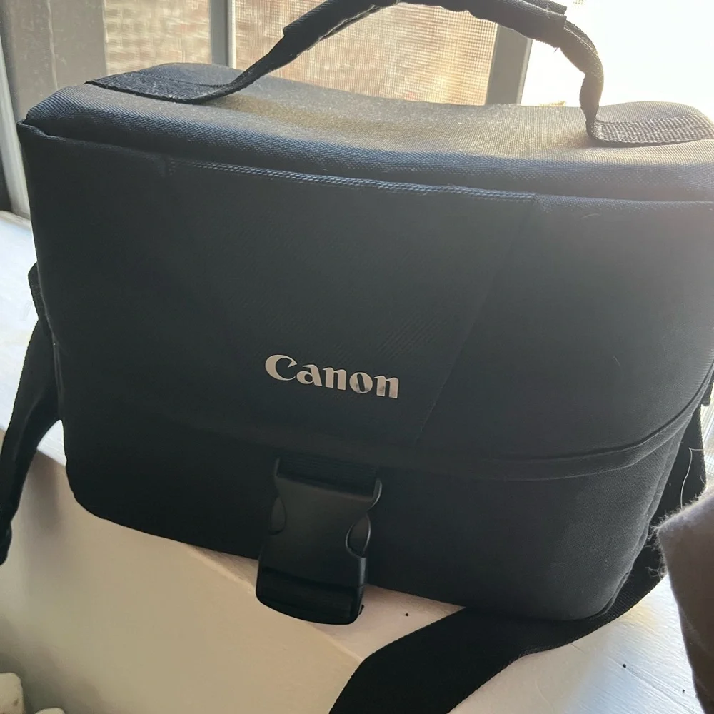 Canon Camera with case, charger, zoom lens and SD card to Apple converter